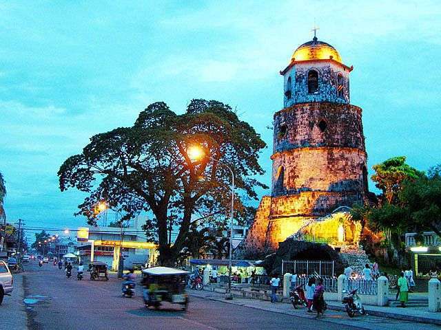 The Belfry Tower in Dumaguete coastal promenade and streetlights - highlights of the City Tour.
