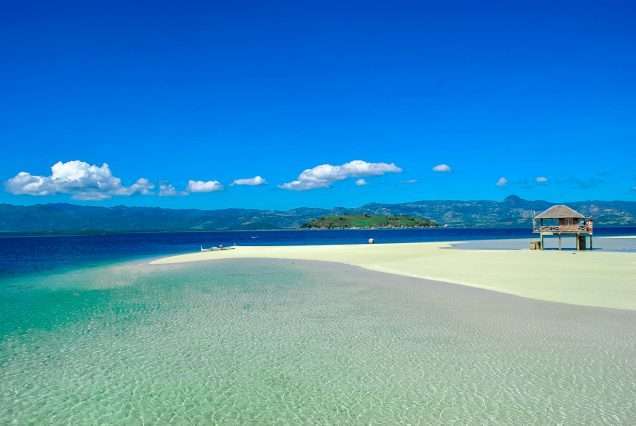 Clear White Sand with Clear waters and Blue Sky - highlights of Bais Dolphin Watching